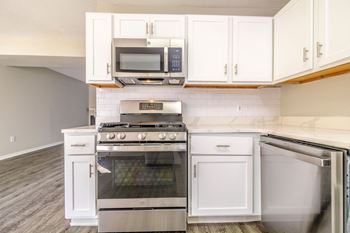 Kitchens with custom cabinetry and gleaming quartz countertops*